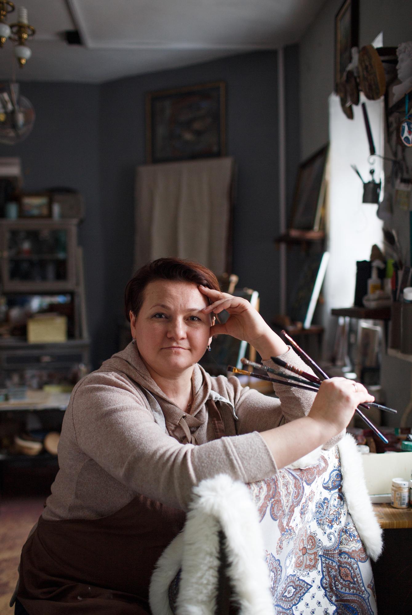 portrait of founder with embroidery hoop